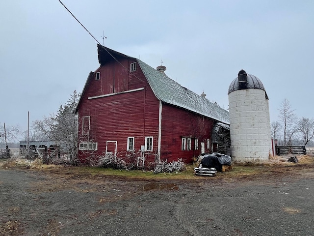 view of side of home with an outbuilding