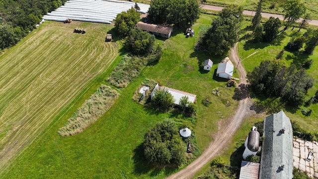 birds eye view of property with a rural view