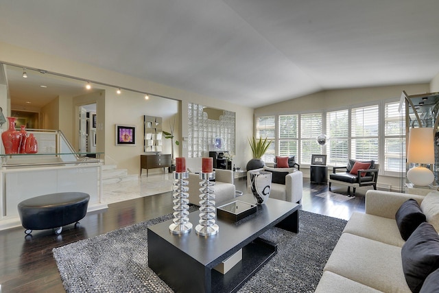 living room featuring lofted ceiling and dark hardwood / wood-style flooring