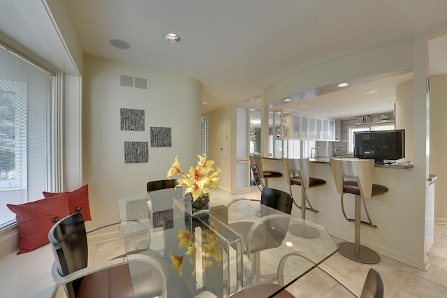 dining space with light tile patterned floors