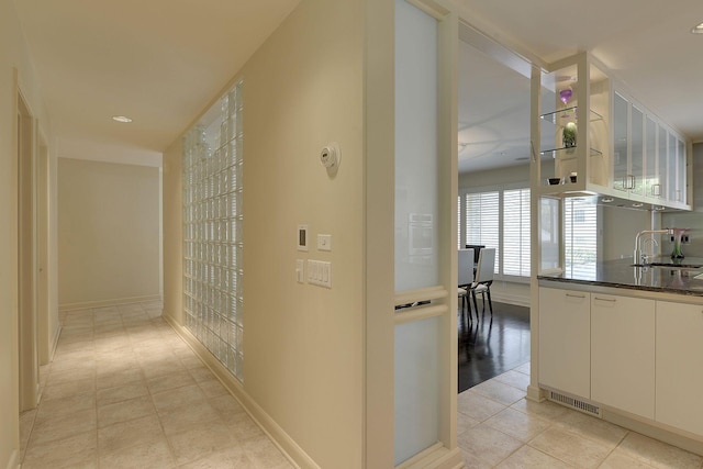 hallway featuring sink