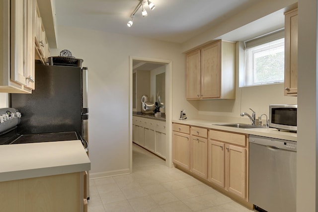 kitchen with sink, light brown cabinetry, and appliances with stainless steel finishes