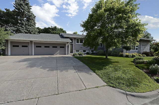 view of front of house with a garage and a front yard