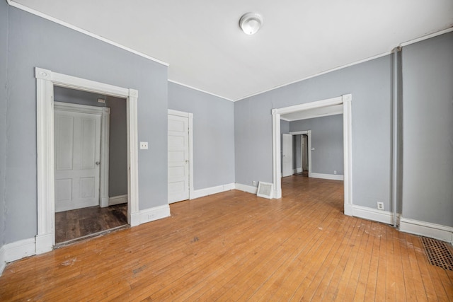 empty room with wood-type flooring