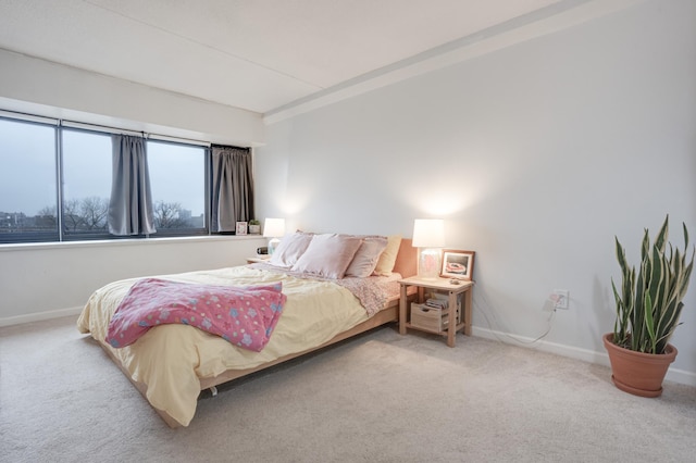 bedroom featuring light carpet