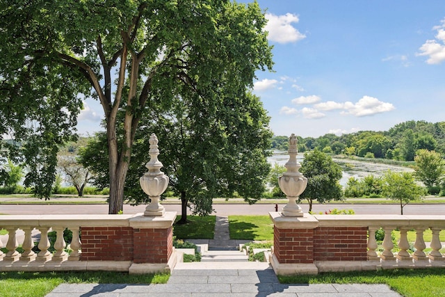 view of community with a water view
