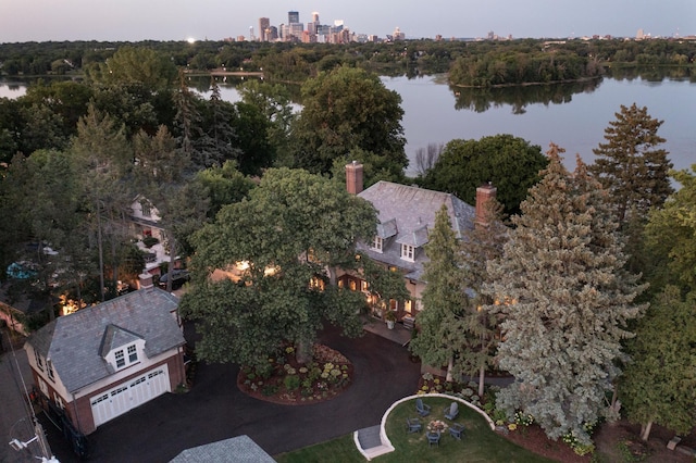 birds eye view of property with a water view