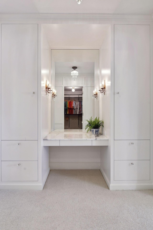 bathroom featuring carpet and baseboards