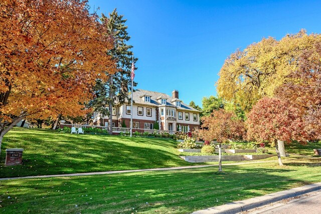 surrounding community featuring a yard