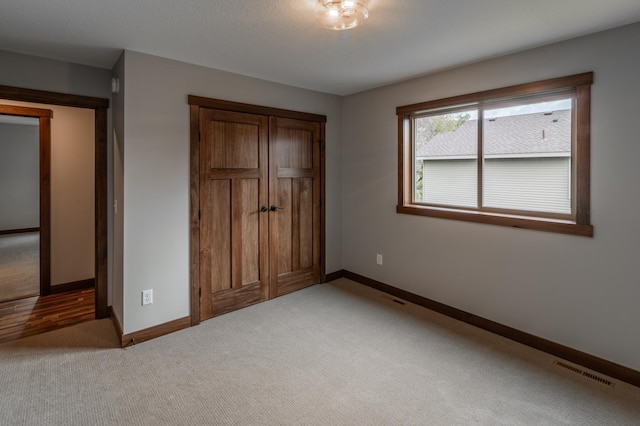 unfurnished bedroom with light carpet