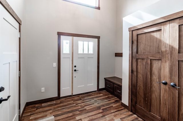 entryway with dark wood-type flooring