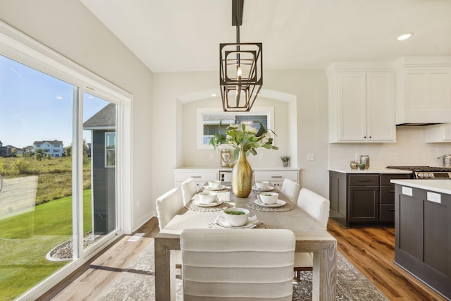 dining area with hardwood / wood-style floors