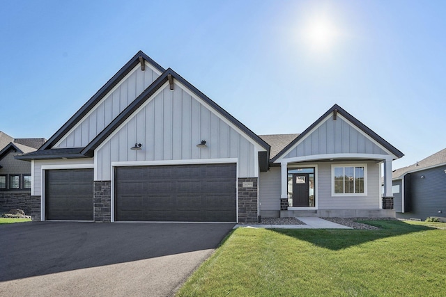 view of front facade with a front lawn and a garage