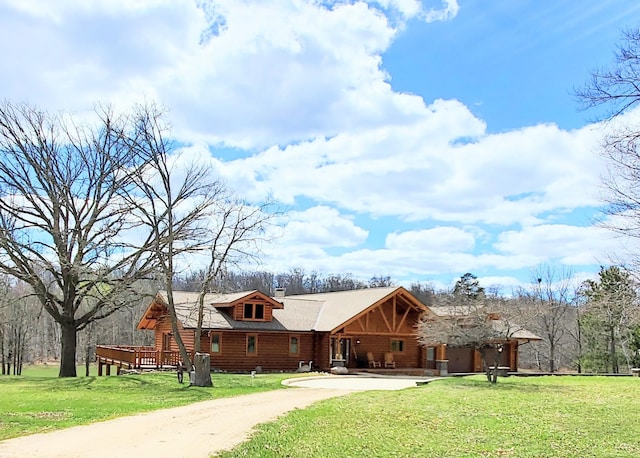 28419 220th St, Shevlin, MN 56676 - log-style house with a front lawn, log exterior, and driveway