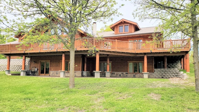 28419 220th St, Shevlin, MN 56676 - rear view of house featuring a wooden deck, a yard, and a chimney