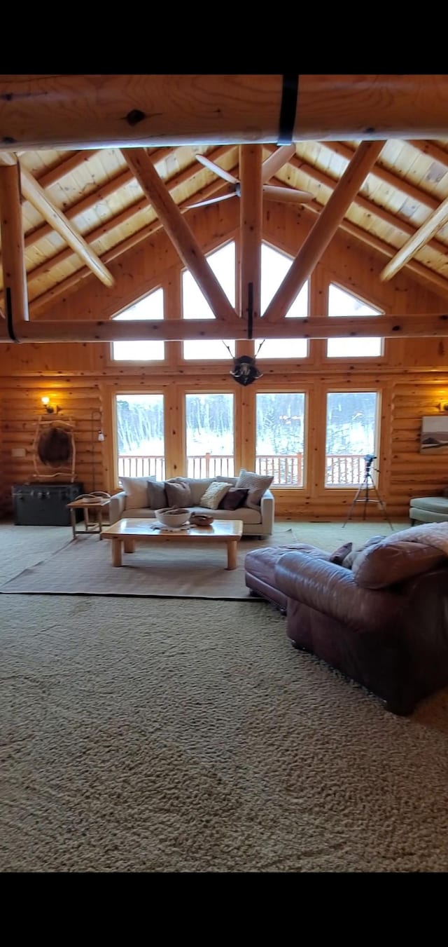 28419 220th St, Shevlin, MN 56676 - living room featuring high vaulted ceiling, beam ceiling, and carpet flooring