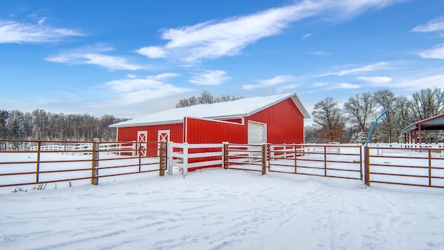 28419 220th St, Shevlin, MN 56676 - snow covered structure featuring a pole building, fence, and an outbuilding