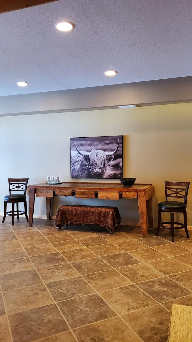 28419 220th St, Shevlin, MN 56676 - hallway featuring recessed lighting, baseboards, a textured ceiling, and tile patterned flooring