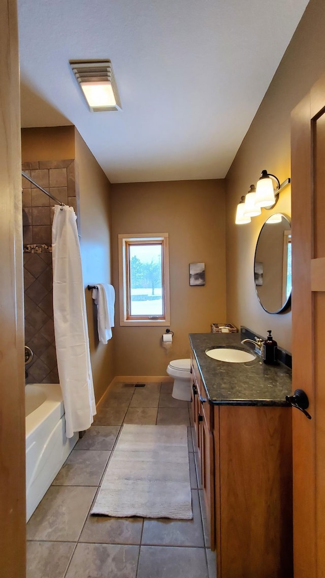 28419 220th St, Shevlin, MN 56676 - full bathroom featuring tile patterned floors, vanity, toilet, shower / bath combo with shower curtain, and baseboards