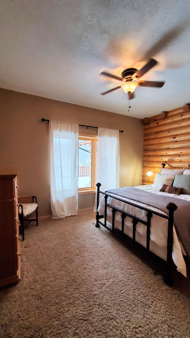28419 220th St, Shevlin, MN 56676 - carpeted bedroom featuring rustic walls, baseboards, and ceiling fan
