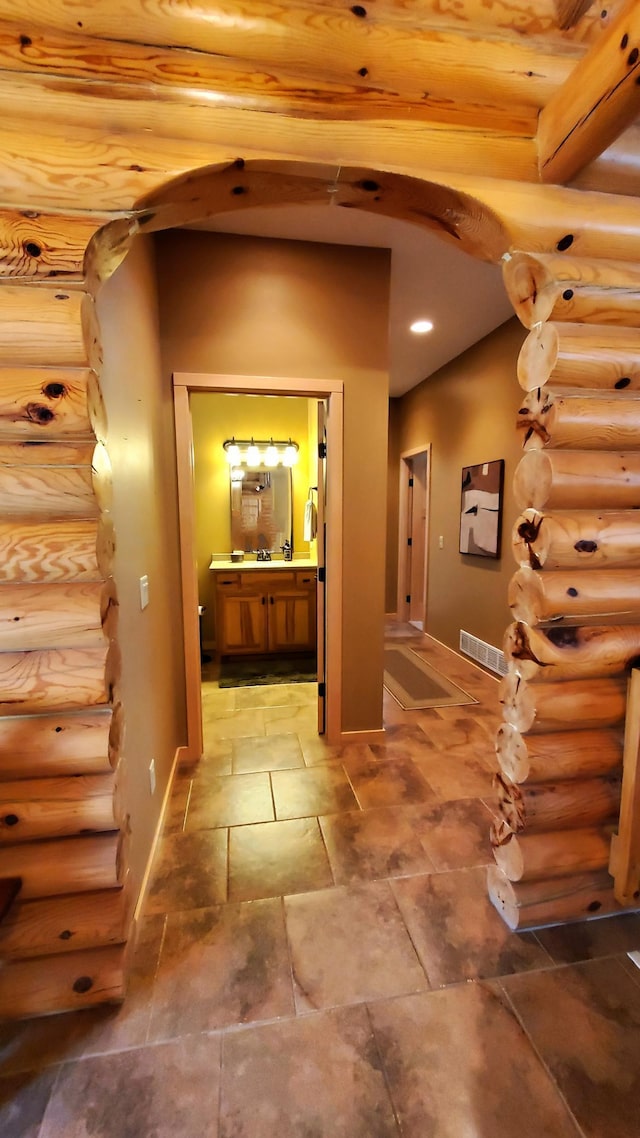 28419 220th St, Shevlin, MN 56676 - hallway with log walls and baseboards
