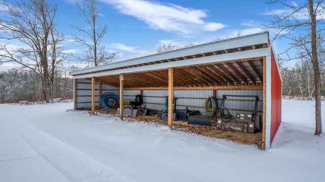 28419 220th St, Shevlin, MN 56676 - snow covered structure featuring an outbuilding and a carport