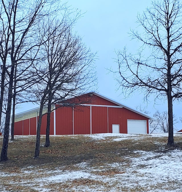 28419 220th St, Shevlin, MN 56676 - snow covered structure with a pole building and an outbuilding