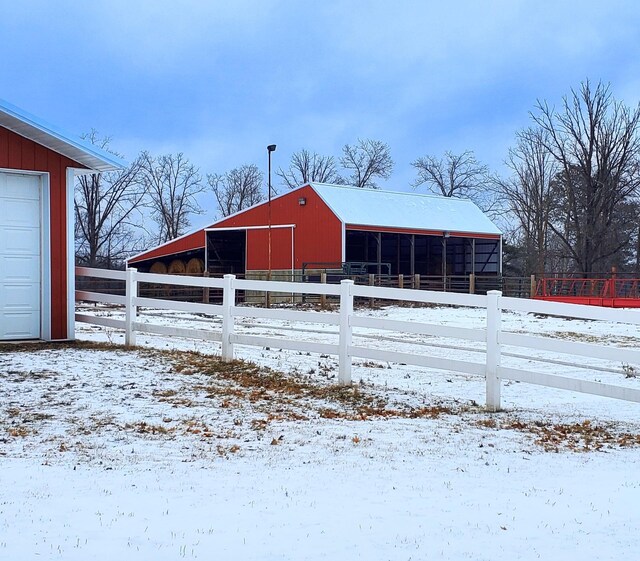 28419 220th St, Shevlin, MN 56676 - snow covered structure featuring a pole building, an outdoor structure, fence, and an exterior structure