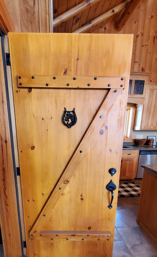 28419 220th St, Shevlin, MN 56676 - detailed view of dishwasher and wooden walls