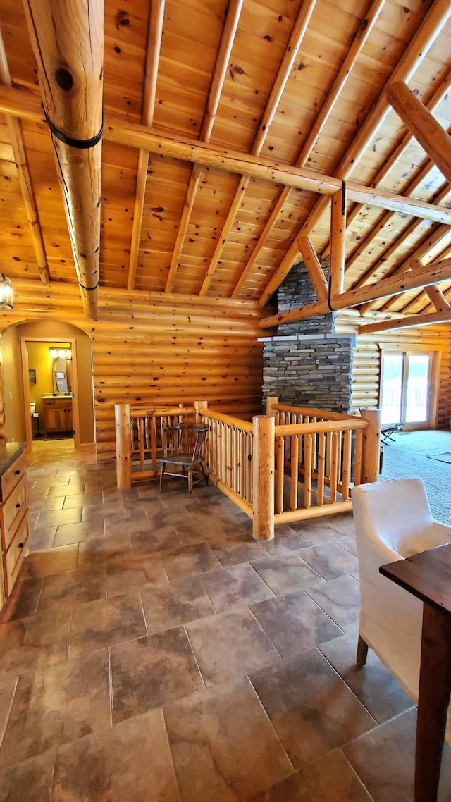 28419 220th St, Shevlin, MN 56676 - bonus room featuring wooden ceiling, beamed ceiling, arched walkways, rustic walls, and high vaulted ceiling