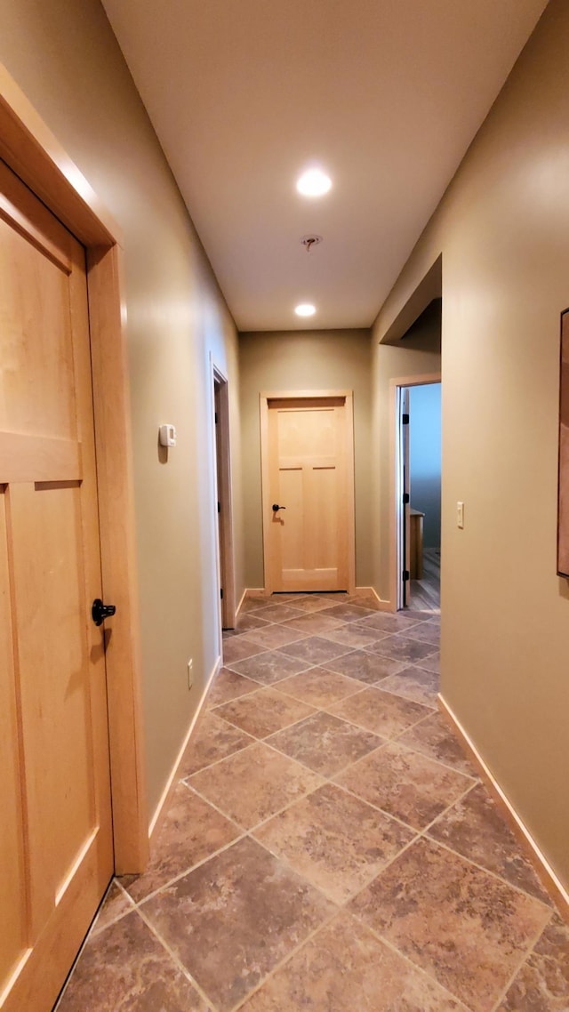 28419 220th St, Shevlin, MN 56676 - corridor with baseboards, recessed lighting, and light stone finish flooring