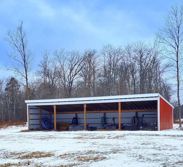 28419 220th St, Shevlin, MN 56676 - snow covered parking area with an outbuilding