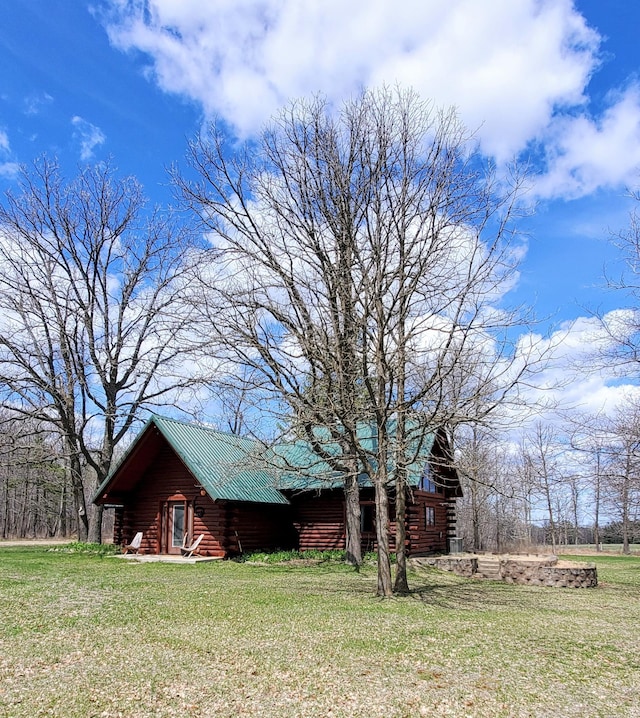 28419 220th St, Shevlin, MN 56676 - view of property exterior with log siding and a lawn