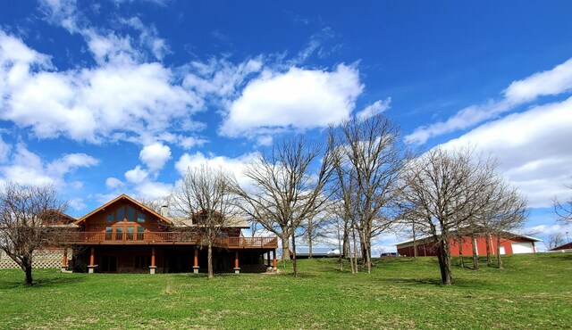 28419 220th St, Shevlin, MN 56676 - view of green lawn with a wooden deck