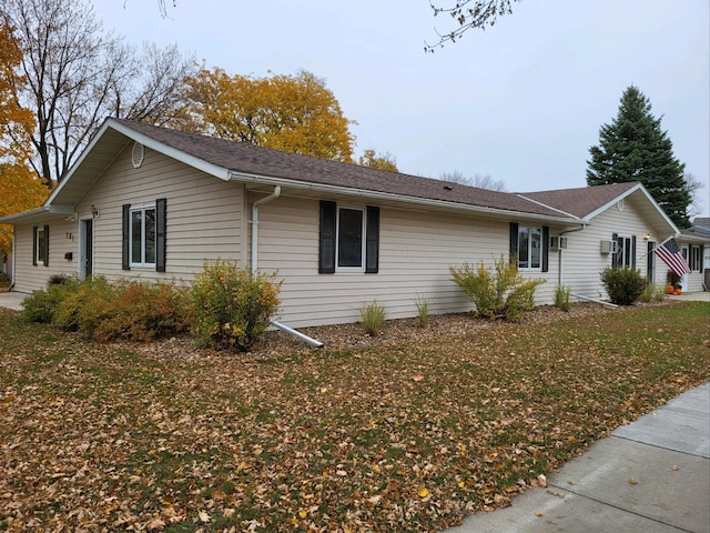 view of property exterior with a lawn