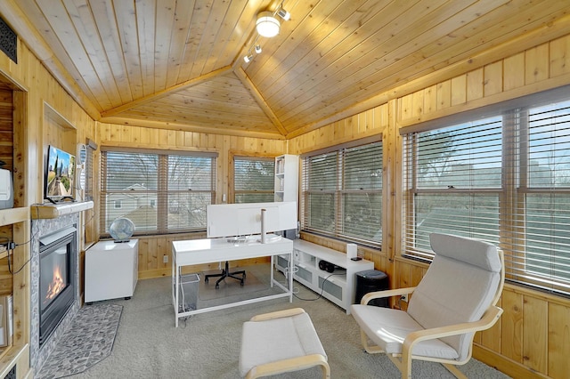 carpeted office featuring lofted ceiling, a tile fireplace, wood walls, and wood ceiling