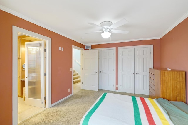 unfurnished bedroom with light carpet, ceiling fan, two closets, and crown molding