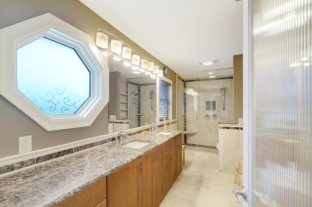 bathroom featuring walk in shower and vanity