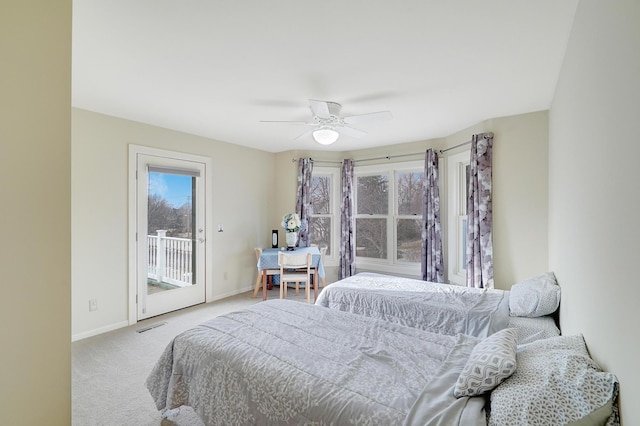 bedroom with ceiling fan, light colored carpet, and access to exterior