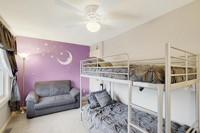 bedroom featuring ceiling fan and carpet