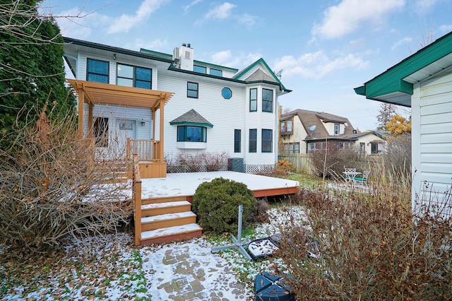 view of snow covered house