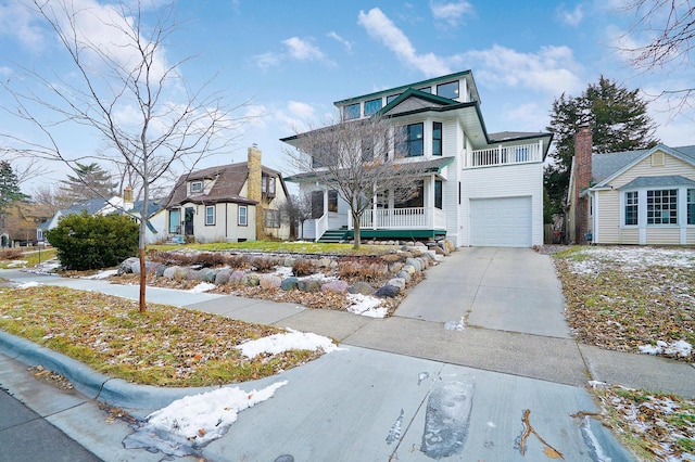 view of front of home featuring a garage and a porch