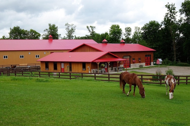 view of home's community with an outbuilding and a rural view