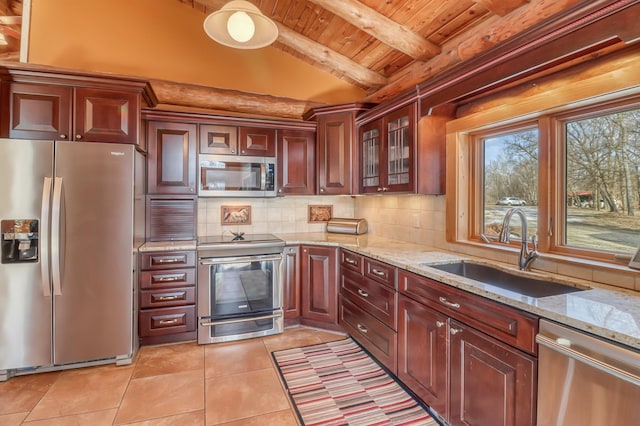 kitchen with appliances with stainless steel finishes, light stone counters, wood ceiling, sink, and lofted ceiling with beams