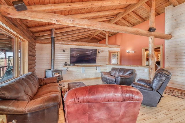 living room with wood walls, wooden ceiling, log walls, and light hardwood / wood-style flooring