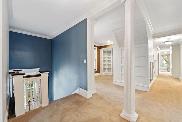 interior space featuring crown molding, light carpet, and ornate columns