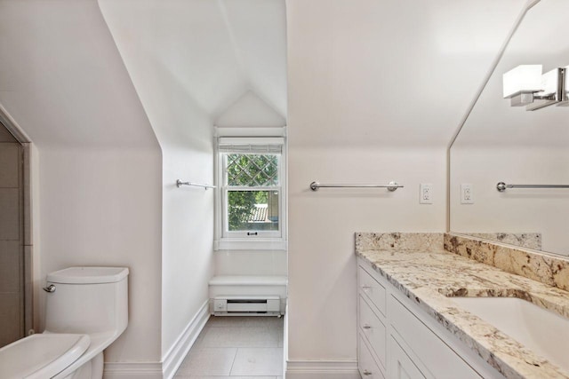 bathroom featuring lofted ceiling, toilet, tile patterned floors, a baseboard heating unit, and vanity