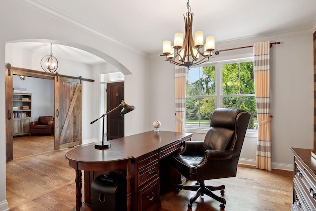 home office featuring a chandelier, a healthy amount of sunlight, and light wood-style floors