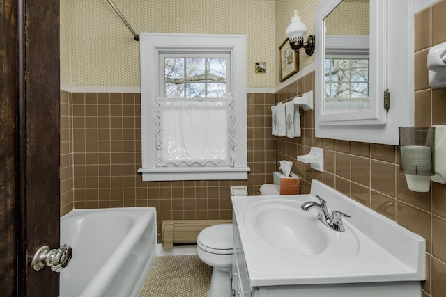 full bathroom with plenty of natural light, tile walls, baseboard heating, and wallpapered walls