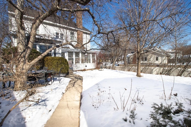 view of yard layered in snow